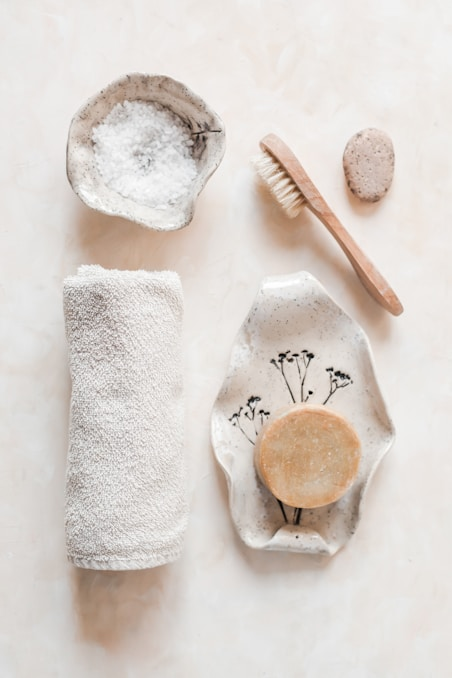 Neatly arranged beauty spa towels and skincare tools prepared for a relaxing spa treatment.