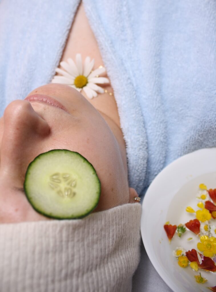 A lady relaxing while receiving a professional facial treatment in a calm and soothing spa environment.