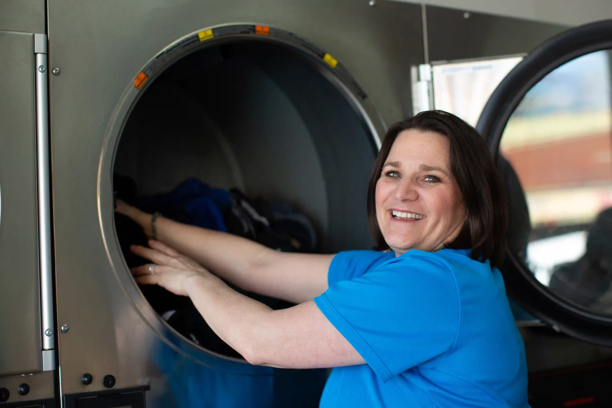 Freshly Folded – Laundry Loaded into Washing Machine At The Best Laundry Service In San Diego