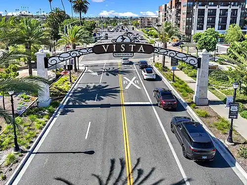 A signage with the word Vista - Dry cleaning in Vista